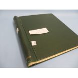 Green stamp album containing a collection of Q.E.