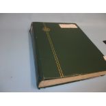 Green stock book containing a quantity of French Colonies stamps