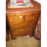 Early to mid 20th Century mahogany bow front chest with a brushing slide above two short and three