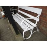 White painted and wrought iron and wooden slatted garden bench