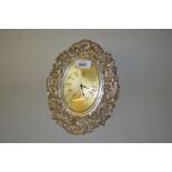 Good quality Victorian floral decorated oval silver mounted strut clock,