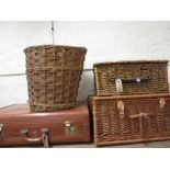 Four wicker baskets and an Aeropack suitcase