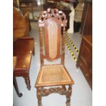 Late 17th Century carved oak side chair with cane seat and back