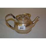 Silver circular bachelor's teapot with half gadroon decoration