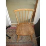 Set of four Ercol stick back kitchen chairs in light elm and beech