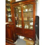 Edwardian mahogany marquetry inlaid two door display cabinet raised on square tapering supports