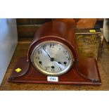 Early 20th Century mahogany dome shaped mantel clock together with a French black slate mantel