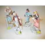 Set of four Capo di Monte figures of musician, drinker, and dancers,