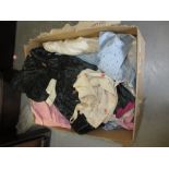 Box containing a quantity of vintage French childrens clothes