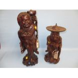 Two oriental carved wooden figures of sages