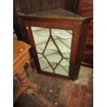 George III oak hanging corner cabinet with a single bar glazed door