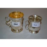 Embossed Birmingham silver Christening mug with gilded interior and another silver Christening mug