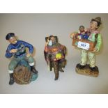 Group of three Royal Doulton figures, ' Organ Grinder ',