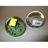 Murano millefiori glass paperweight together with another glass paperweight