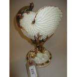 Royal Worcester shell form vase decorated with gilded shells and a figure of a lizard