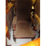 Early Victorian mahogany and upholstered reclining library chair on turned front supports with