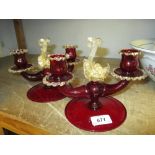 Pair of Salviati Murano red and gilt clear glass two branch candlesticks with sea serpent finials