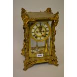 Late 19th or early 20th Century French gilt brass four glass library clock,