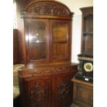 Pair of Victorian carved oak standing corner cabinets,