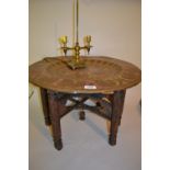 Circular Benares tray top coffee on folding carved hardwood stand,