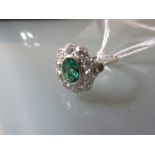 18ct White gold oval emerald and diamond cluster ring