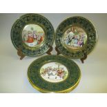 Set of six Caverswall Christmas plates decorated with Dickensian scenes within a green and gilt