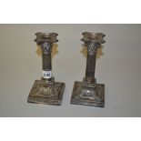 Pair of Sheffield silver Corinthian column candlesticks on square bases,