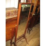 Early 20th Century mahogany rectangular swing frame cheval mirror on shaped supports