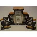 French Art Deco black slate and marble three piece clock garniture,