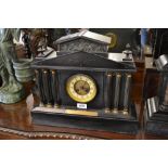 Large 19th Century black slate mantel clock having circular dial with Arabic numerals and two train