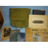 Green canvas bag containing a quantity of military related items including two Air Raid Precautions