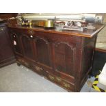 18th Century oak mule chest with hinged plank lid above a four panel front and three drawers