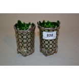 Pair of white pierced white metal vases with green glass liners (unmarked)