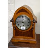 Victorian oak and burr oak mantel timepiece with a silvered dial,