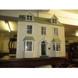 Good quality modern dolls house with hinged opening roof and double bay front together with a