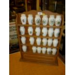Set of twenty four Franklin Mint spice pots mounted on a wooden wall bracket