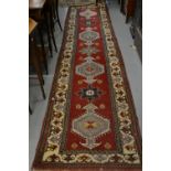 Turkish Persian pattern runner on wine ground,