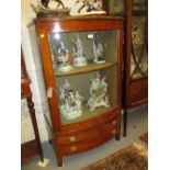 Edwardian satinwood and inlaid bow fronted display cabinet with a single glazed door above two