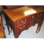 18th Century mahogany lowboy with moulded top above five drawers raised on turned supports with pad