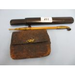 Japanese opium pipe housed in a wooden box with attached leather pouch mounted with a bronze ojime