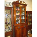 Late 19th Century walnut bookcase, the moulded cornice above a pair of glazed doors,