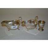 Pair of Birmingham silver helmet shaped cream jugs with scroll handles,