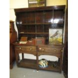 19th Century oak dresser with a boarded shelf back above two drawers raised on square cut supports