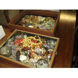 Large brown canvas covered jewellery box containing a large quantity of various costume jewellery