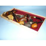 Tray containing a quantity of various pipes,