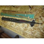 Group of three late 20th Century fishing rods and a children's wooden sledge