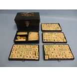 Miniature leather cased bone and bamboo Mahjong set