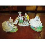 Pair of Sitzendorf porcelain figures of girls with crinoline dresses together with another of a boy