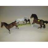 Beswick horse and foal group together with two other Beswick figures of horses