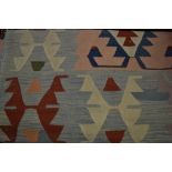 Two similar Kelim geometric design rugs
